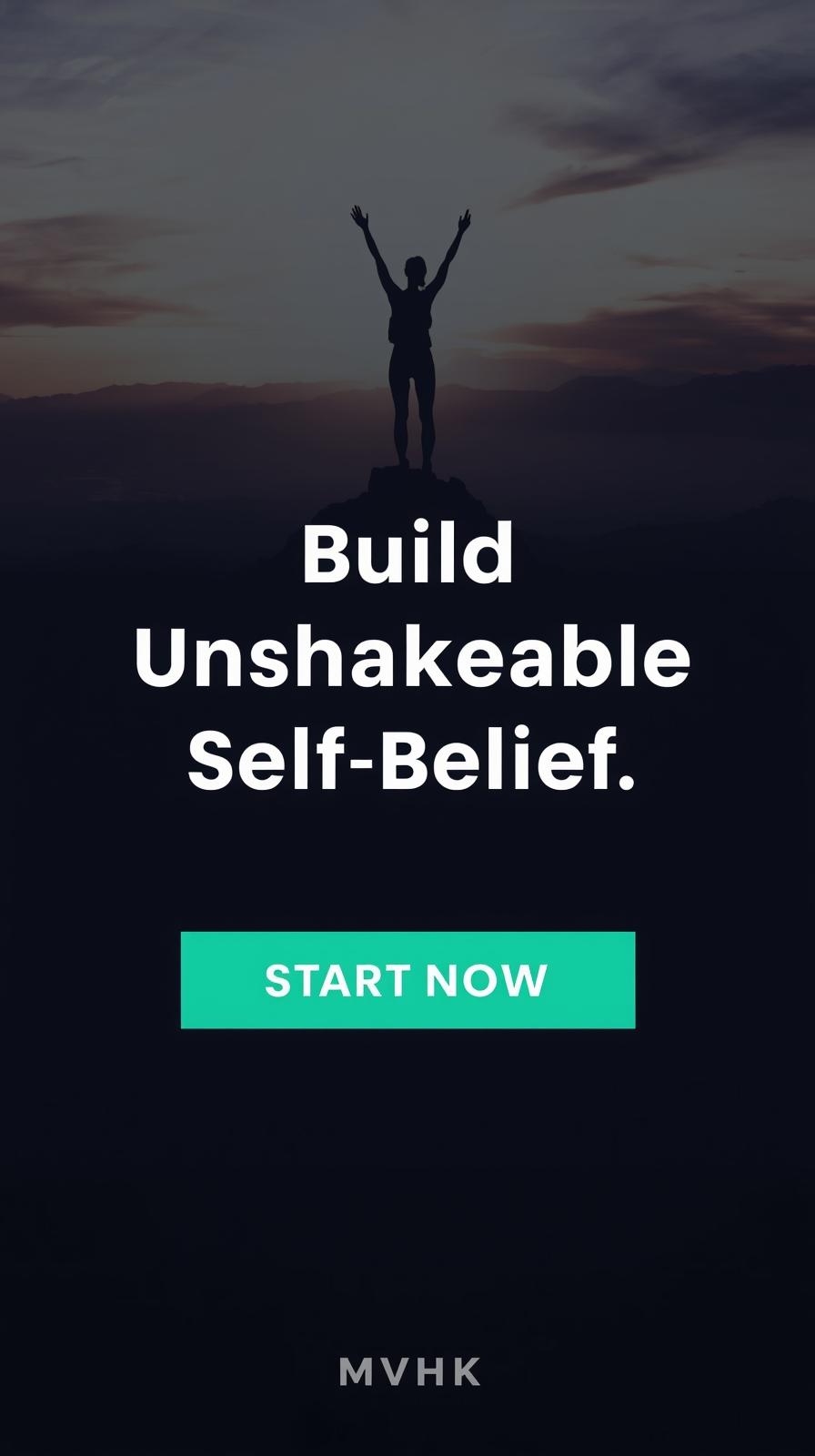 Woman standing confidently on mountaintop sunrise